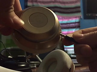 busty white beats solo2 headphones penetrated by big black headphone jack