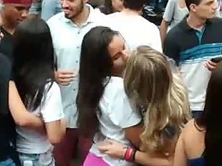 Three girls kissing public